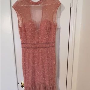 Evening Gown dress designed by Lara. Used in good condition. Size 10